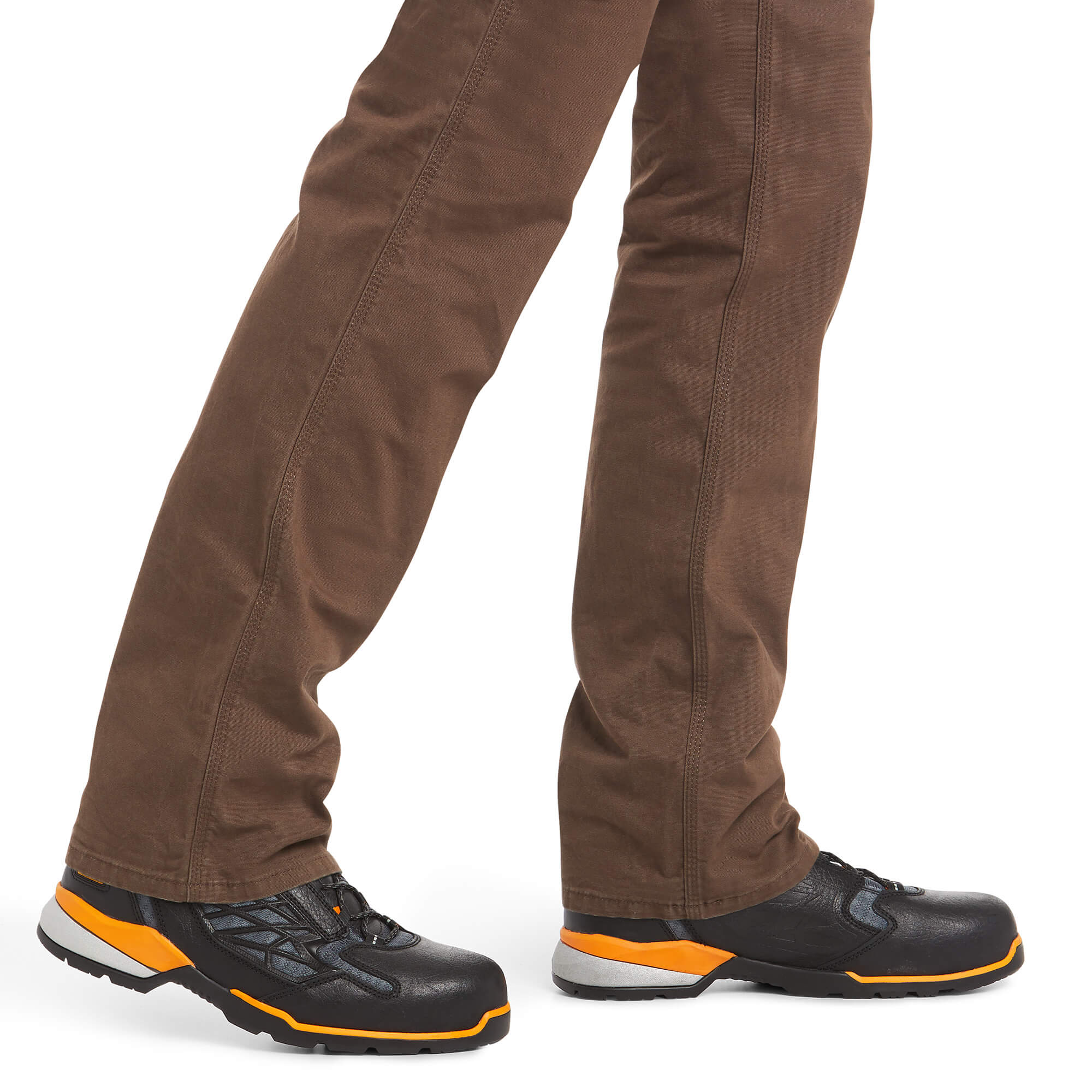 Front view  of men's Ariat wren Rebar pants showing hem and how pants fit over work boots. 