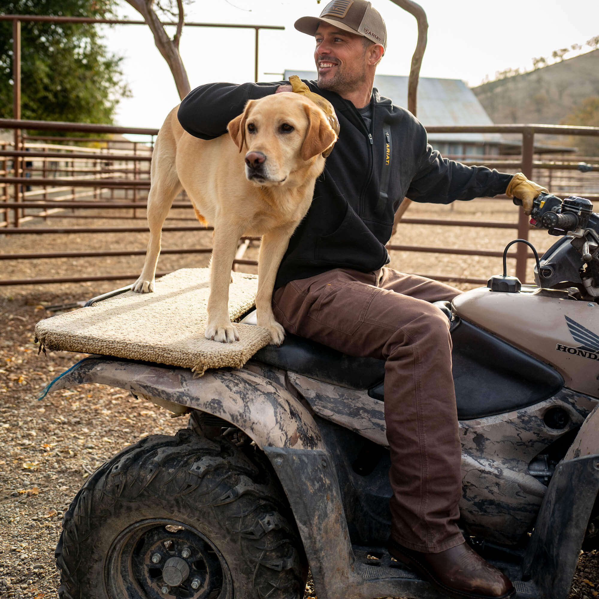 Lifestyle photo of men's Ariat  wren brown Rebar work pant.