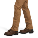 Right view of men's Ariat Rebar in Field Khaki pants showing hem and how pants fit over work boots. 