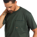 Ariat Men's Rebar short sleeve Workman T-Shirt in Deep Forest. Close up of left chest pocket showing Ariat logo. 