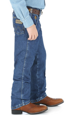 Side view of boys' Wrangler George Strait heavyweight stone denim cowboy cut original fit jeans.