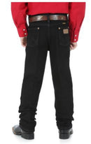 Back view of a boy wearing overdyed black Wrangler cowboy cut jeans with a five-pocket design and flat copper rivets.