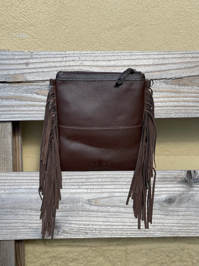 This Coffee Brown tooled leather and cowhide bag has side fringe. Rear View 