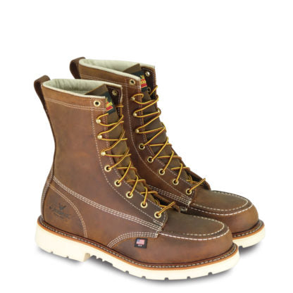 A pair of Thorogood men's boots with brown Crazyhorse leather, a steel safety toe, and yellow lace eyelets.