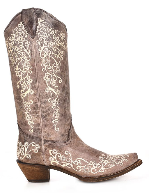 Women's brown leather snip toe boot with bone embroidery design. Side View 