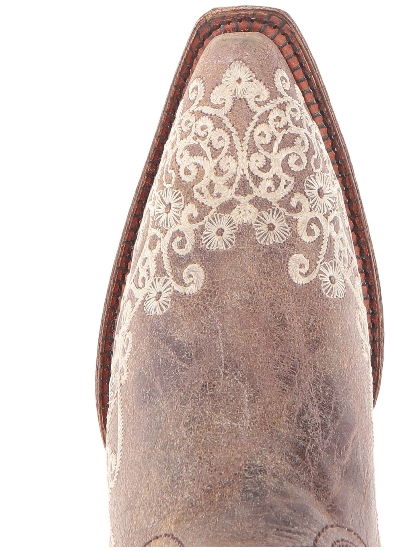 Women's brown leather snip toe boot with bone embroidery design. Close up view of toe details. 