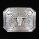  This is a silver tone rectangle buckle with a stylish smooth edge. It features a centered longhorn motif on a western scroll engraving.