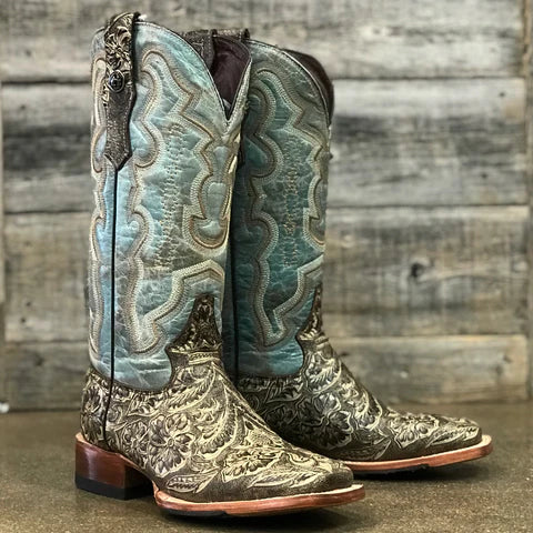 Women's Tanner Mark square toe boots. These boots have a Rustic Brown embossed vamp and a Italo Blue Tiffany shaft. They feature a matching embossed leather pull strap and have a hybrid outsole. Front view