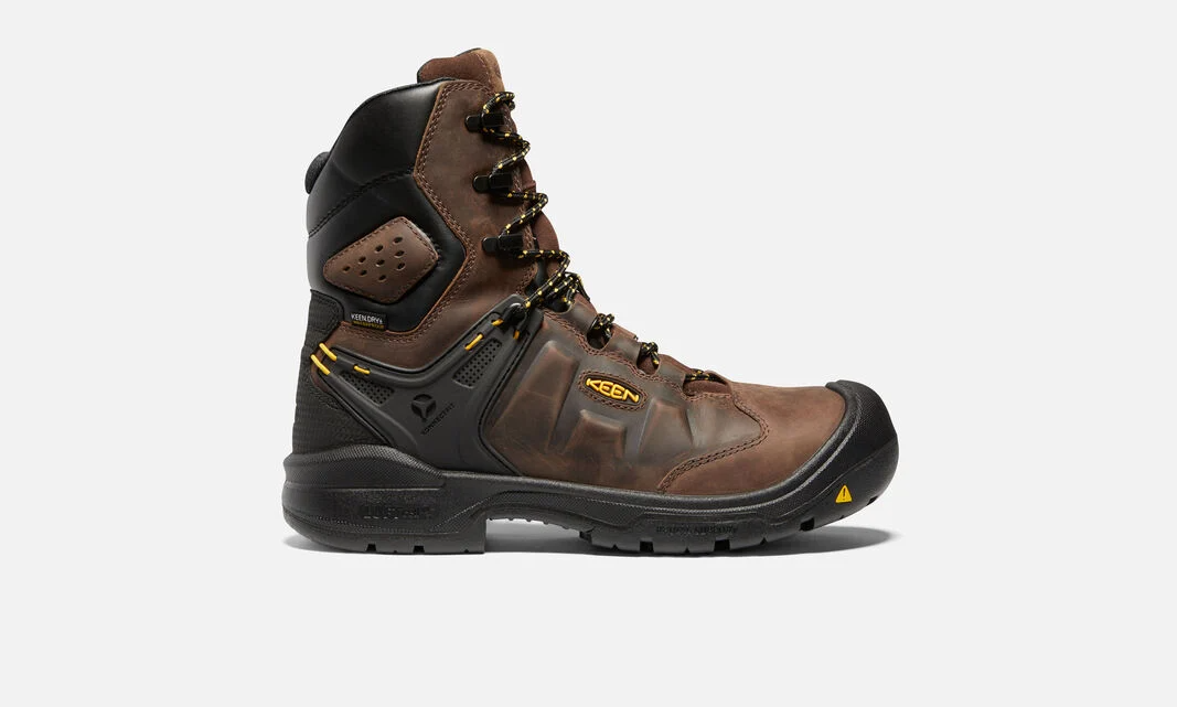 Keen Men's Dover 8 inch waterproof boots with carbon-fiber toe in Dark Earth and Black color, featuring a lace-up closure and a rubber outsole. Single boot view showing side view. 