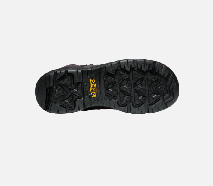 Keen Men's Dover 8 inch waterproof boots with carbon-fiber toe in Dark Earth and Black color, featuring a lace-up closure and a rubber outsole. Bottom view showing outsole. 