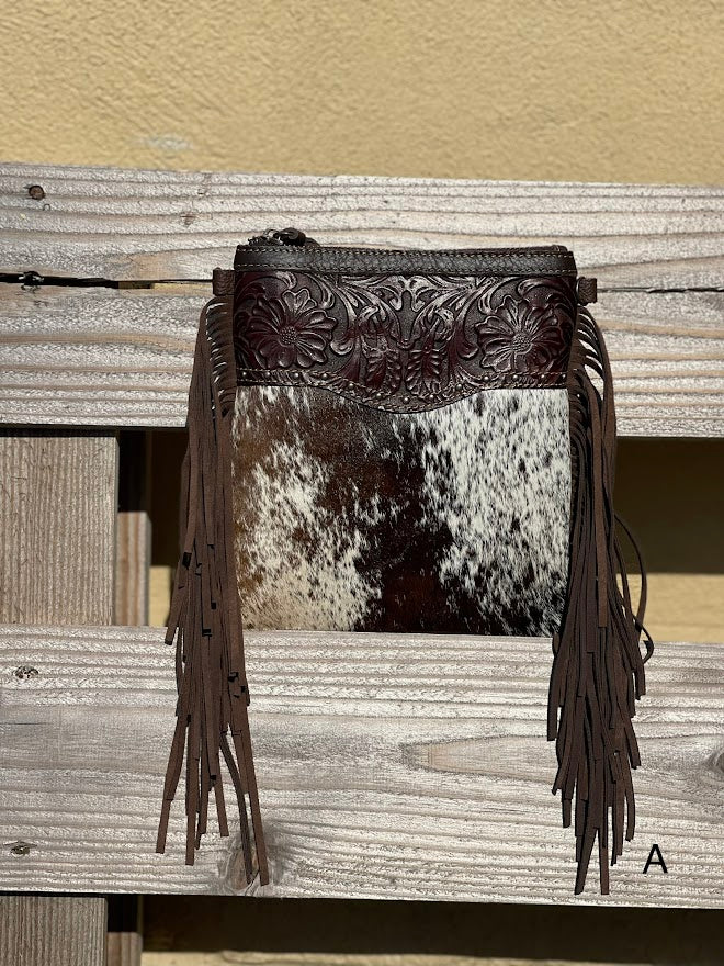 This Coffee Brown tooled leather and cowhide bag has side fringe. Front View A
