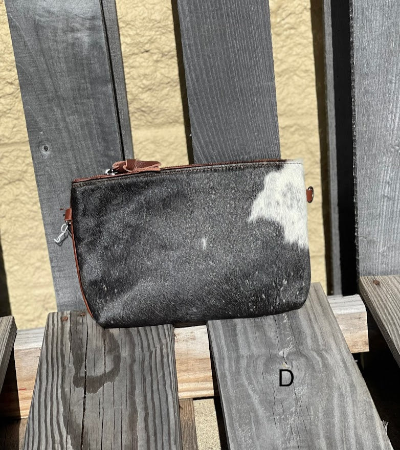Cowhide wristlet with detachable crossbody strap with a solid Brown leather back. Front View D