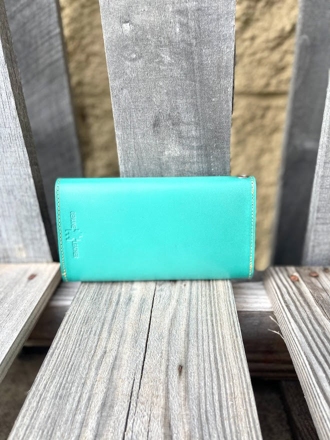 Turquoise Basketweave leather phone case wallet with wristlet strap.  Rear view showing smooth leather. 