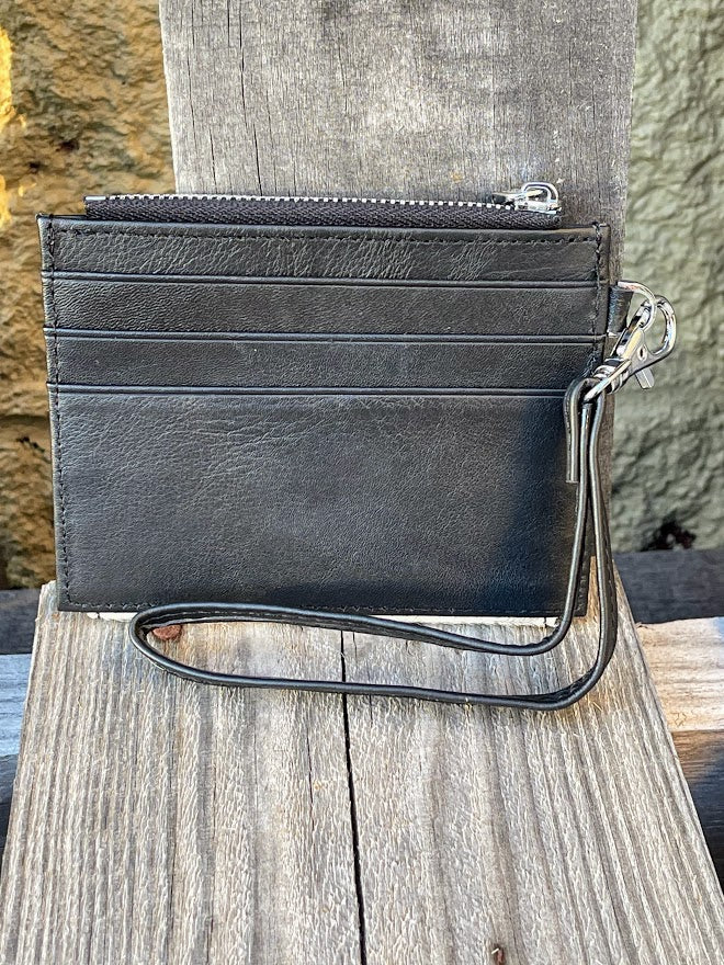 This black leather and cowhide wristlet wallet has six total card slots along with a zippered close pocket. Rear view showing three card slots. 