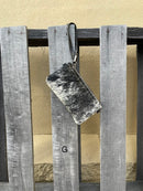 Cowhide wristlet purse in Black leather with a zippered closure. This bag has a wristlet handle or shoulder strap. Front View G