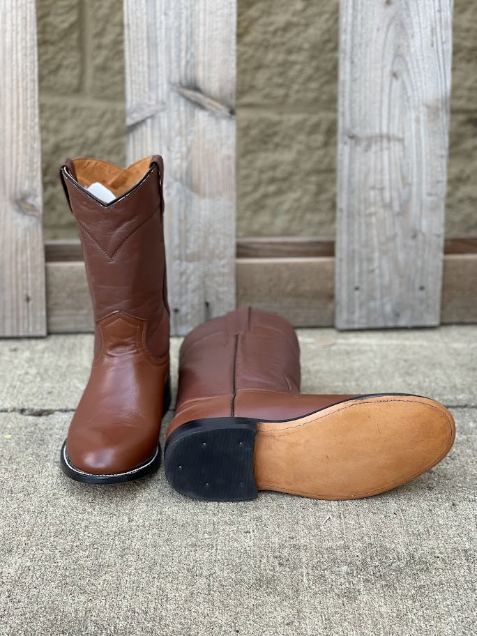 Brown Cowtown men's 10-inch roper boots. Bottom view showing leather outsole. 