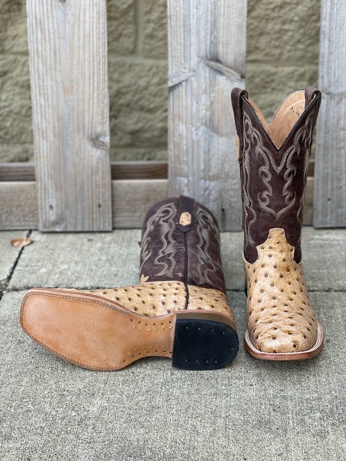 Men's Cowtown square toe boots with a 12-inch leather shaft and Oryx Full Quill Ostrich-print vamp. Bottom view showing leather outsole. 