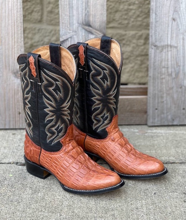 A pair of Cowtown brand cowboy boots with a 12-inch leather shaft featuring a cognac caiman tail cut print. Side View 