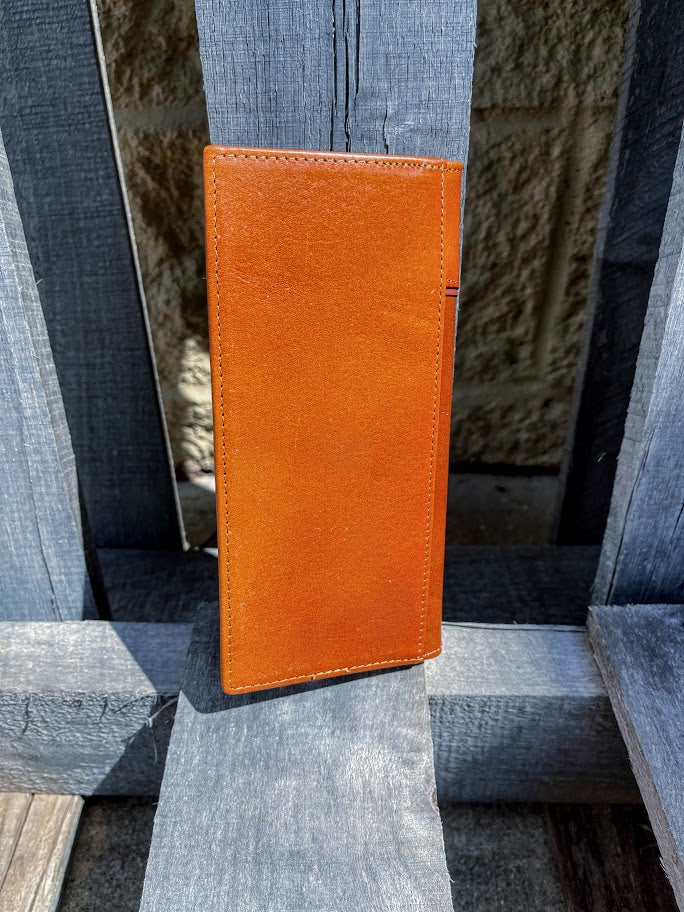 Light Brown leather tall wallet with a Brown inlay and a embossed Praying Cowboy design.  Rear view