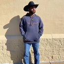 Men's fleece hoodie in navy color with large embroidered horns on the chest and leather draw cord stops on the hood. Shown on model.
