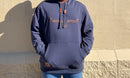 Men's fleece hoodie in navy color with large embroidered horns on the chest and leather draw cord stops on the hood. Close up front view