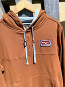 Men's Kimes Ranch Hoodie in Brown.  Close up of logo patch on left chest. 