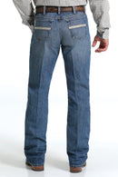 Men's White Label Light Wash jeans back view showing detail of back pockets, belt loop placement, relaxed fit on seat and leg, stack on boots.