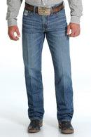 Men's White Label Light Wash jeans front view showing detail of front pockets and zipper. Also shows relaxed  fit and stack on boots.