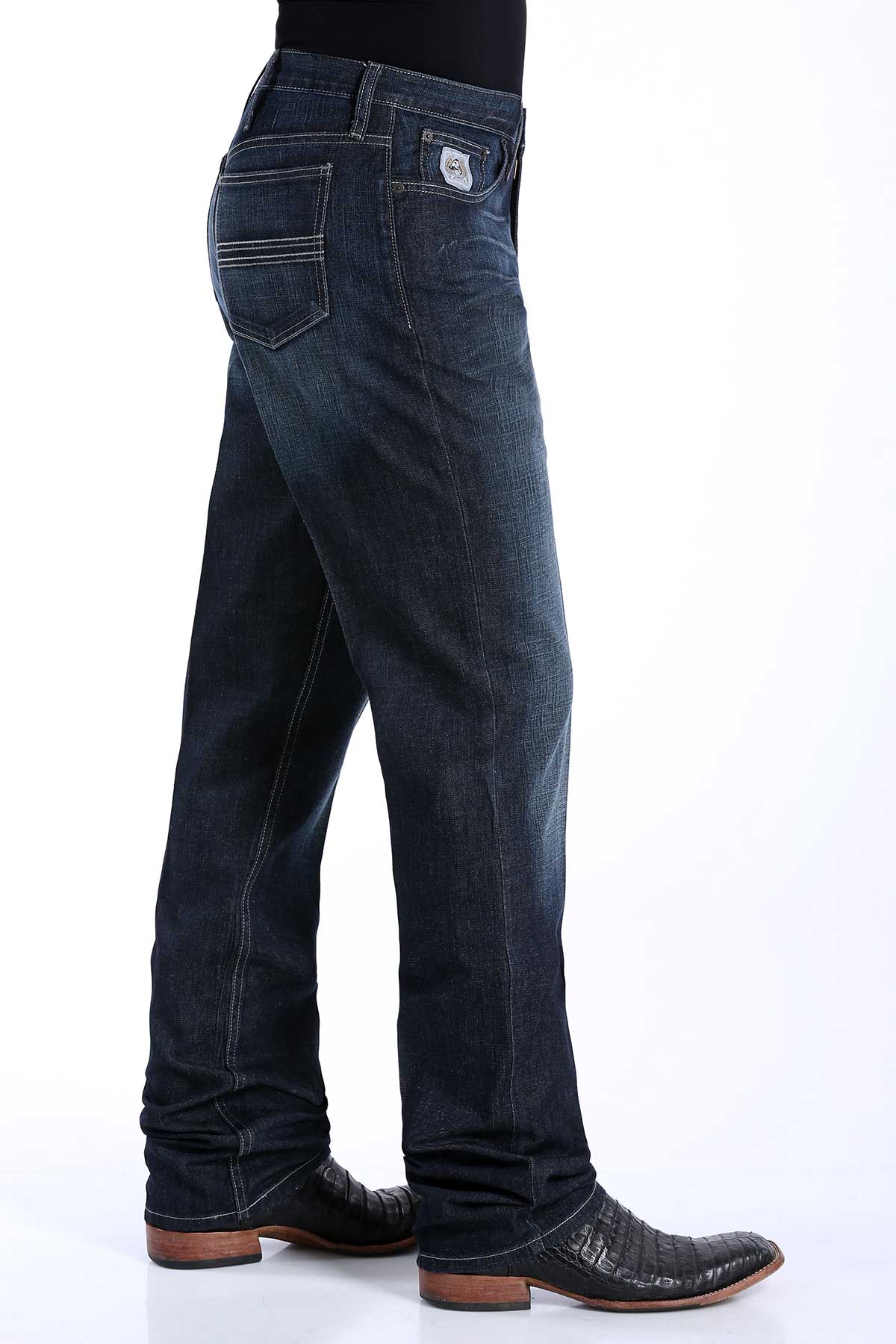 Side view of Cinch Silver Label dark wash jeans. Shows detail of right front coin and hip pockets, back pocket, and slim fit with straight leg on boots.
