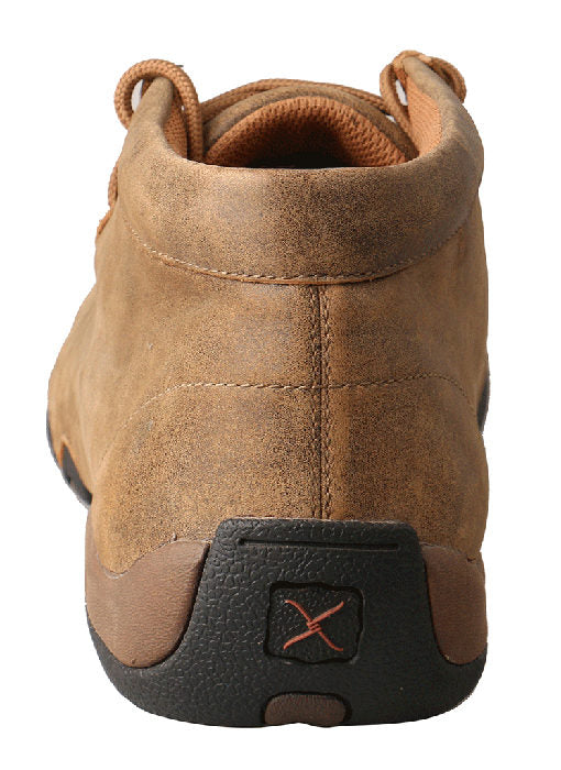 A heel view of a women's brown distressed leather twisted x driving moc with rubber sole.