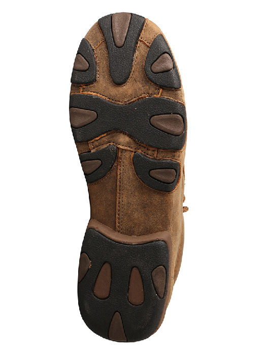 A rubber outsole view of a women's brown distressed leather twisted x driving moc.