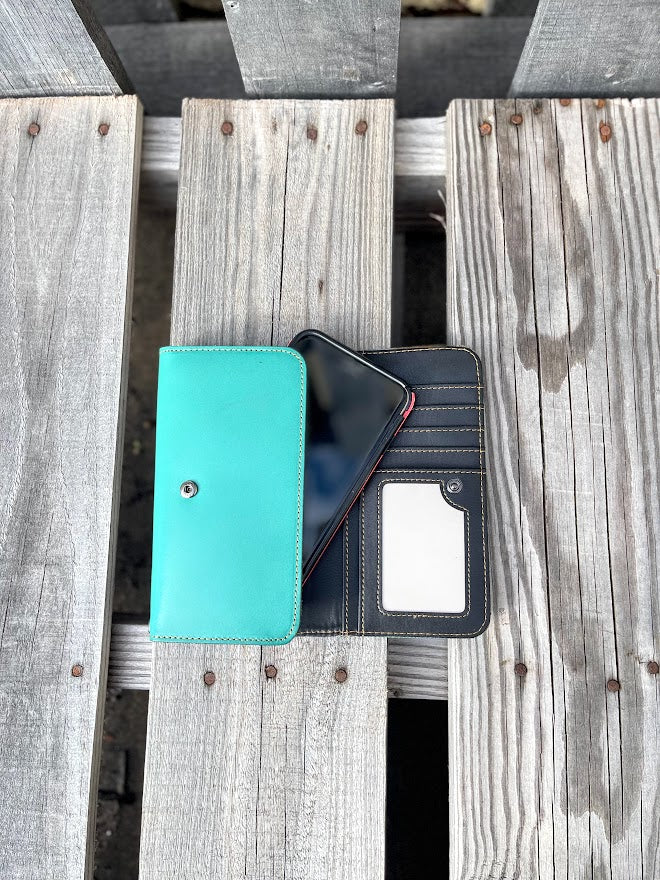 Turquoise Basketweave leather phone case wallet with wristlet strap. Inside view showing ID window, multiple card slots, and phone fitting in pouch. 