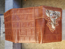 Brown alligator print leather tri-fold wallet featuring an upper hair-on framed section with a cowboy praying at the cross Concho. Rear View