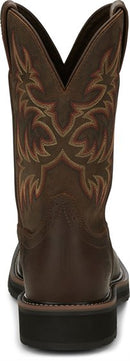 A back view of a pair of Justin Men's Driller Brown Square Toe Work Boots with a decorative stitch pattern in Yellow and Orange on the shaft.