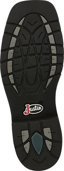 A outsole view of a pair of Justin Men's Driller Brown Square Toe Work Boots.