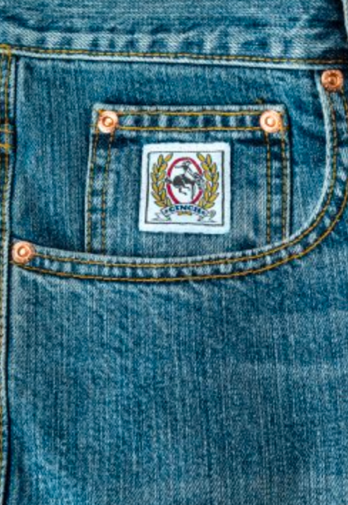 Close-up of right front showing coin pocket and scoop hip pocket of Cinch White Label jeans .