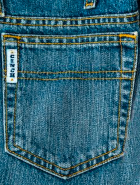 Close-up of back pocket stitching of Cinch White Label jeans.