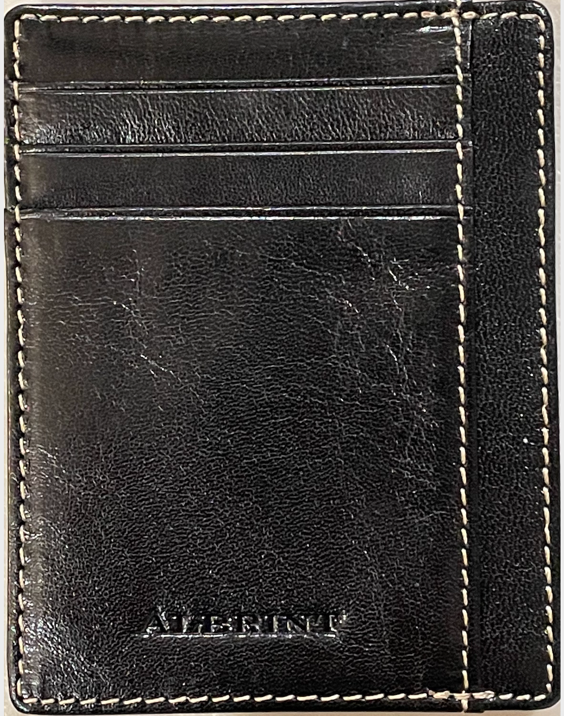 A black full grain leather front pocket wallet with visible stitching and the brand name 'Albrint' embossed on the bottom right.