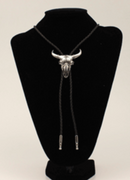 A silver-colored steer skull bolo tie with a black braided leatherette cord.