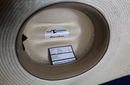 Inside view American Hat company straw hat with drilex sweat band. 