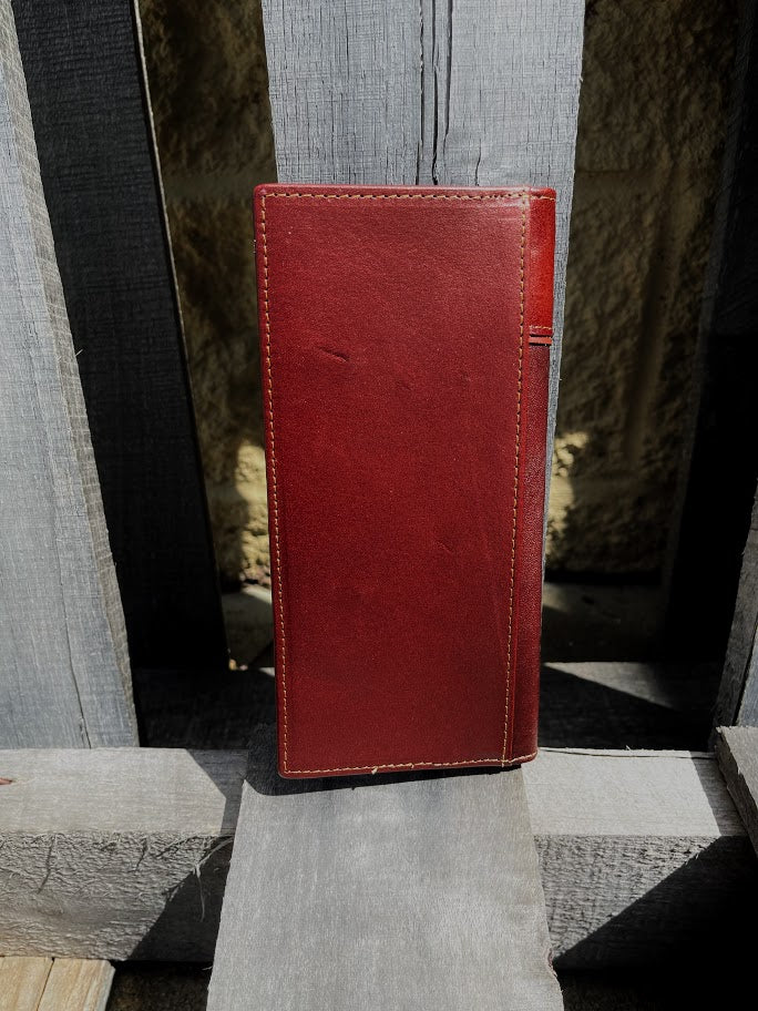 Brown leather tall wallet with embossed Bull Rider design with a Brown inlay.  Rear View
