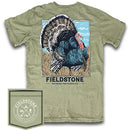 A Khaki colored short-sleeve pocket t-shirt with a front graphic print of a turkey and the brand name 'Fieldstone Outdoor Provisions Co.' The shirt also includes a small brand patch on the lower left side.