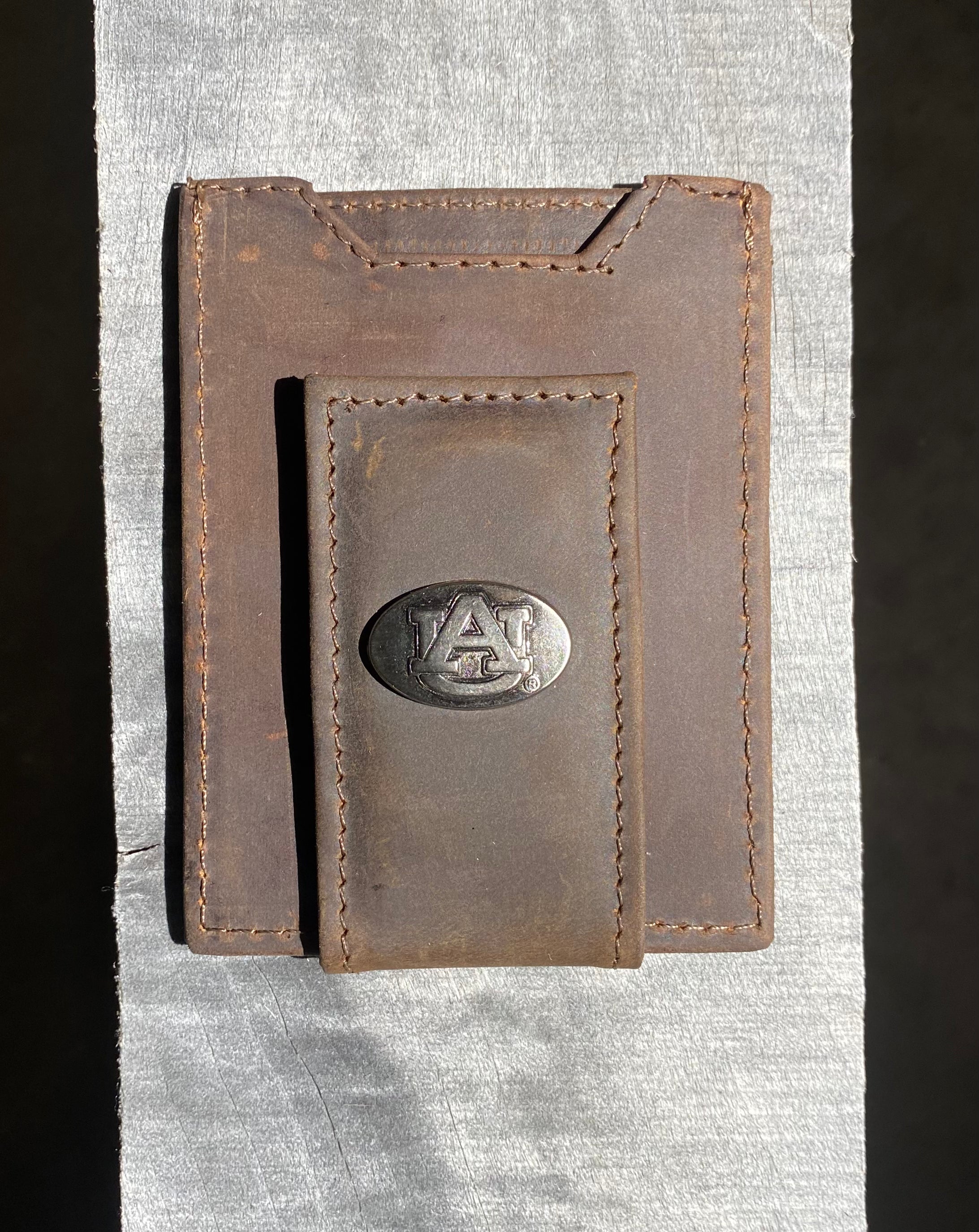 Zep Pro Auburn University Brown “Crazy Horse” Leather Front Pocket Wallet with brass "AU" oval concho on bill closure tab. Front view.