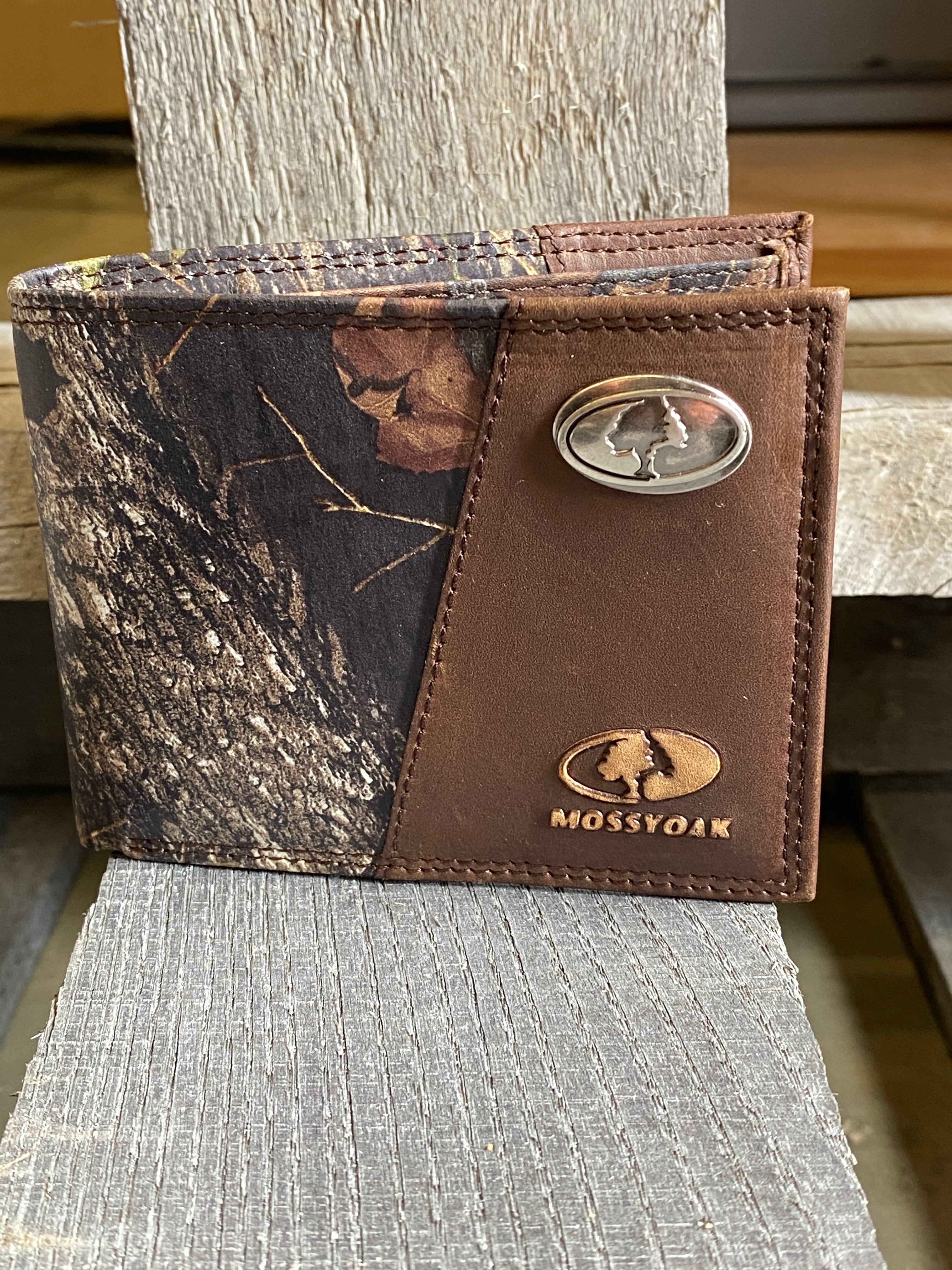 Zep-Pro 1/2 Mossy Oak Camo/Brown Leather Bi-fold Wallet with front view showing Mossy Oak oval metal concho on upper right corner and logo embossed below.