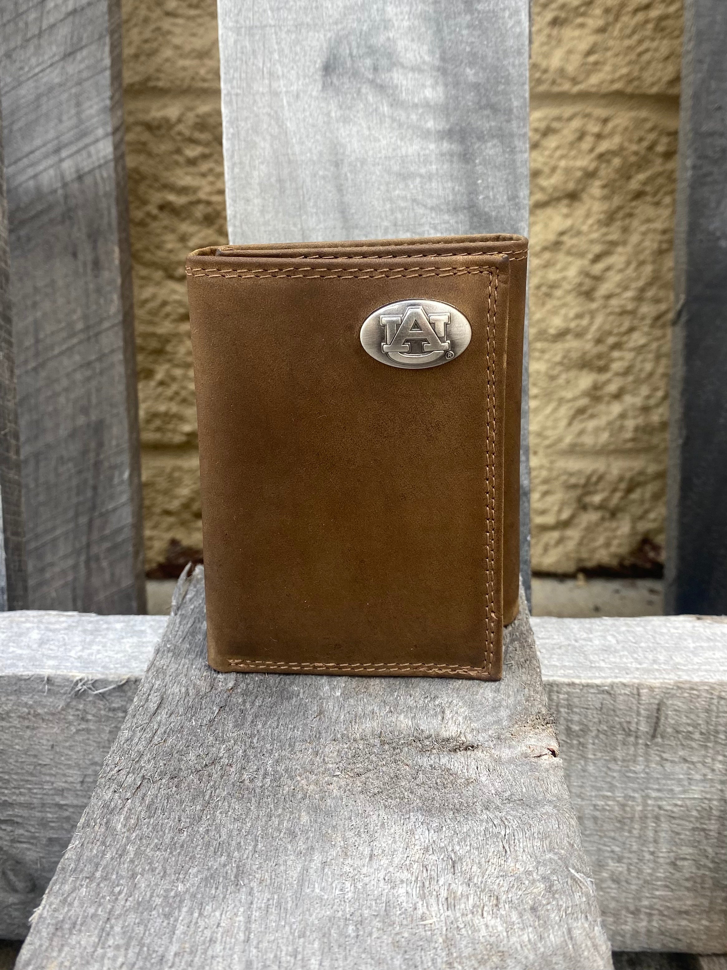 Zep-Pro Auburn University Tigers Light Brown “Crazy Horse” Leather Trifold Wallet  with brass Gators logo oval concho on top right corner.  Front view
