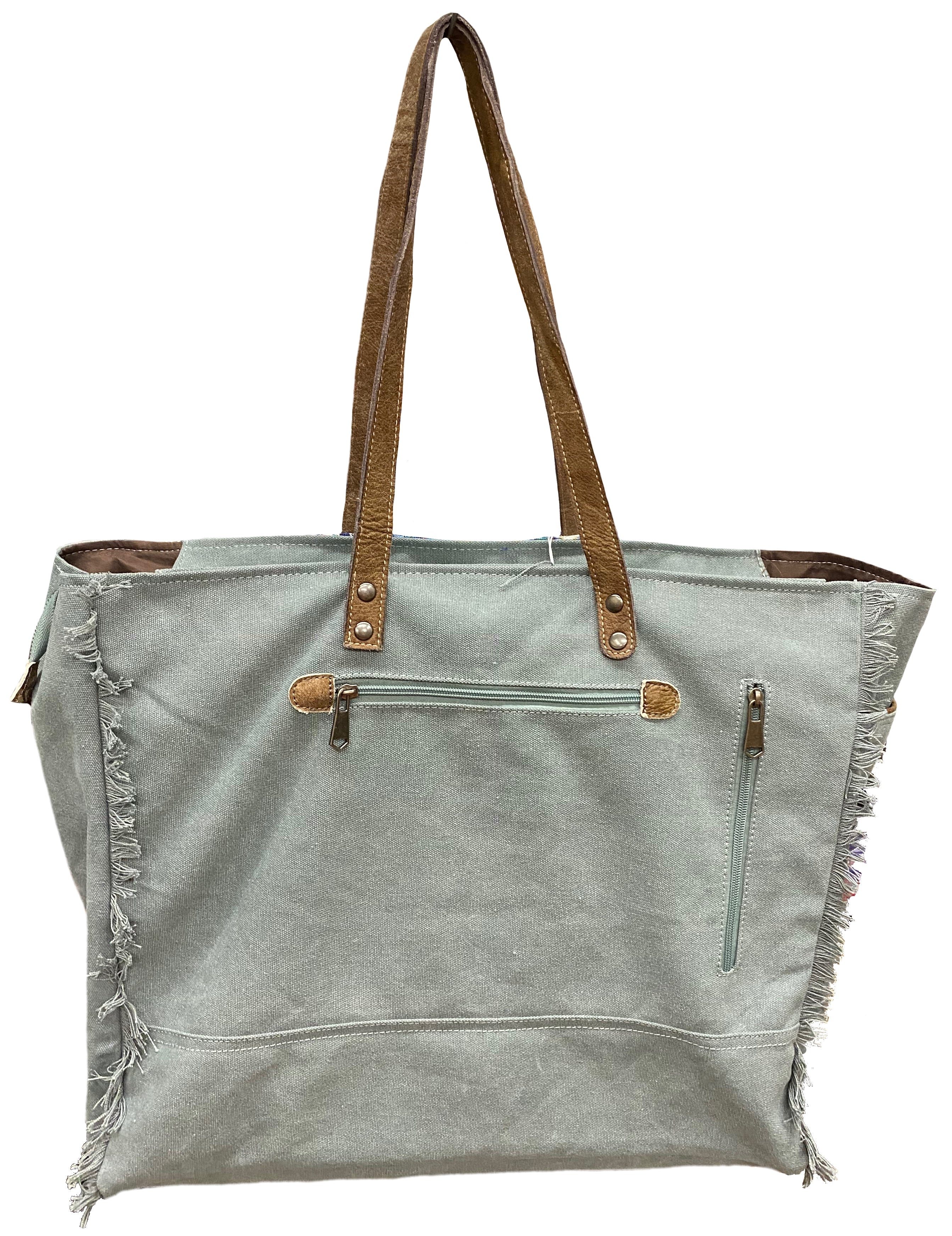 A blue multi canvas and leather conceal carry weekender bag with a geometric pattern. Rear view of bag. 