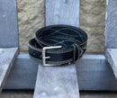 A black leather work belt with white figure 8 stitching and a nickel plated buckle. Front view.
