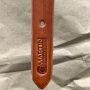 End of Martin Saddlery chestnut harness leather breast collar tug showing stamped logo.