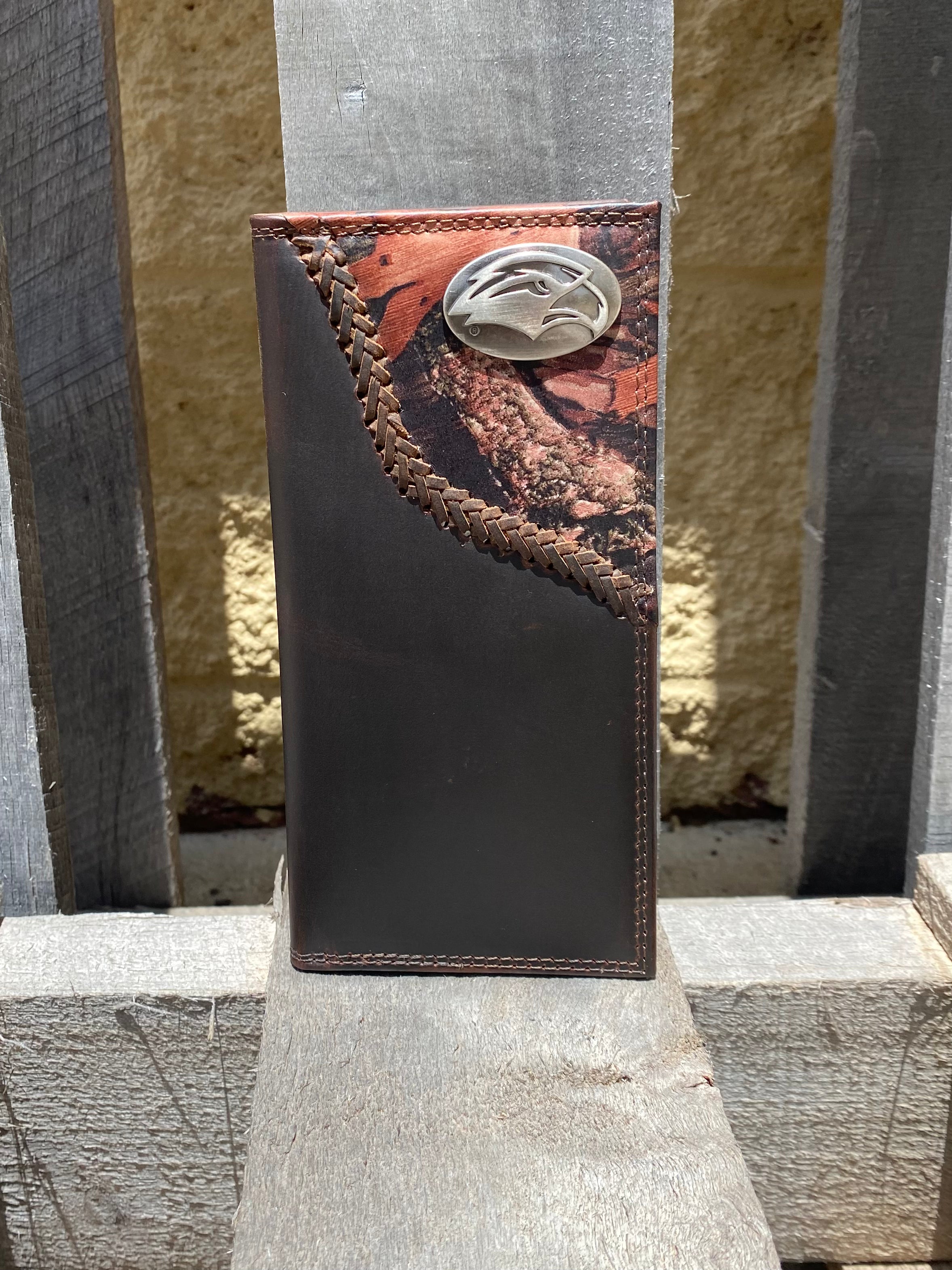 Zep-Pro University of Southern Mississippi Golden Eagles 1/2 Mossy Oak Camo/Brown Leather Tall Wallet front view shows the Golden Eagle logo oval brass concho on top right. 