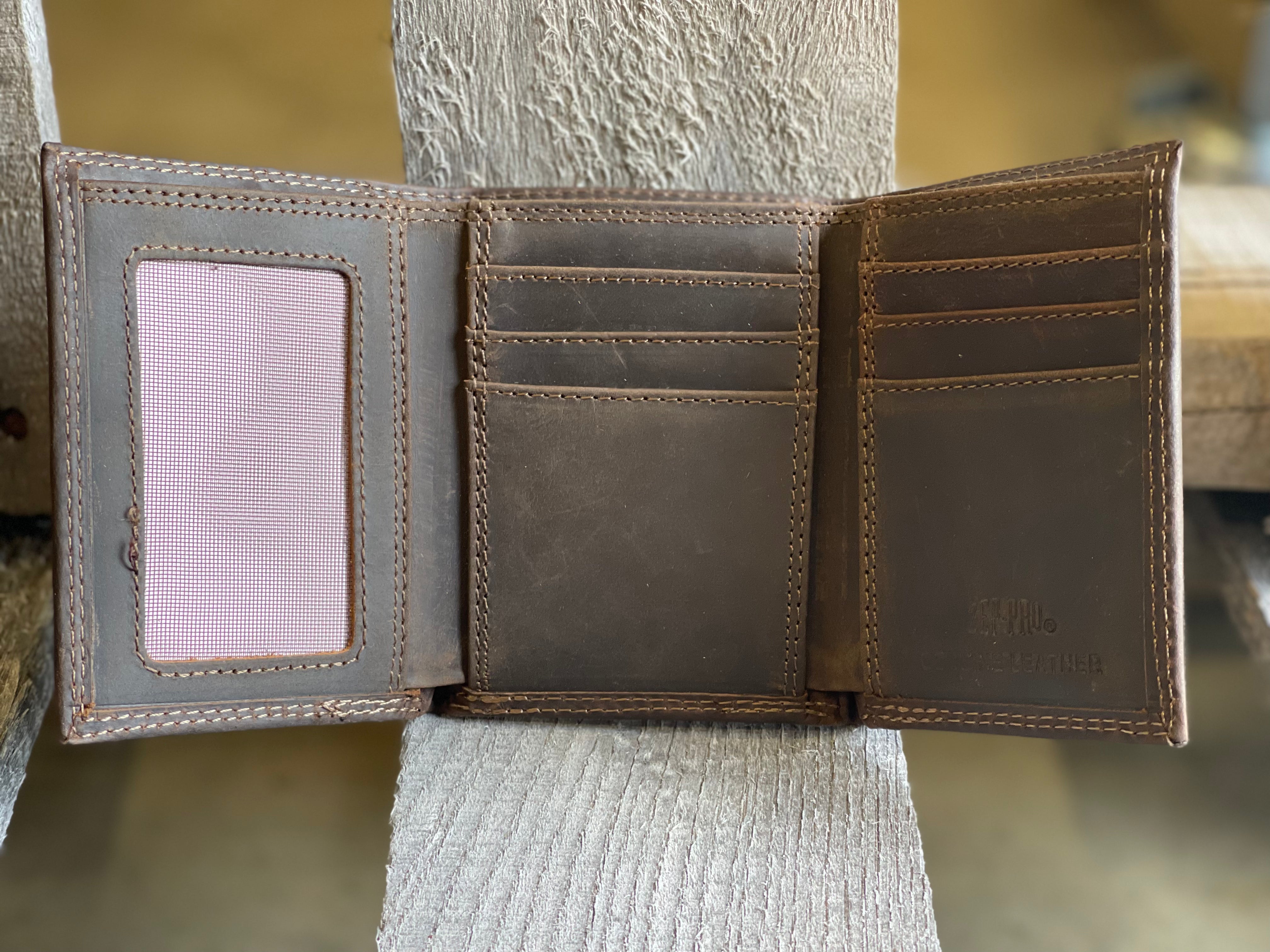 Inside view of LSU "crazy horse" leather trifold wallet featuring:
6 interior credit card slots
2 interior pockets
1 ID window
2 bill/cash compartments
